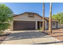 Charming single-story home with a two-car garage and well-maintained landscaping in a quiet neighborhood at 702 W Sequoia Dr, Phoenix, AZ 85027