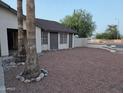 Charming single-story home featuring desert landscaping and mature palm trees at 702 W Sequoia Dr, Phoenix, AZ 85027