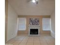 Spacious living room features a fireplace and lots of natural light at 702 W Sequoia Dr, Phoenix, AZ 85027