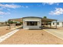 Charming single-Gathering home featuring covered parking and low maintenance desert landscaping at 714 S 86Th Pl, Mesa, AZ 85208