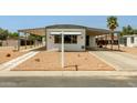Exterior of home with covered parking, desert landscaping and neutral exterior paint at 714 S 86Th Pl, Mesa, AZ 85208