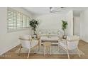 Bright living room with modern furnishings, neutral tones, and ample natural light from large windows at 8144 E Vista Dr, Scottsdale, AZ 85250