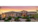 Beautiful home with desert landscaping, stone accents, and a tiled roof at 10934 E La Verna Way, Scottsdale, AZ 85262