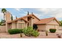 Single-story house with desert landscaping and a three car garage at 1139 E Stephens Dr, Tempe, AZ 85283