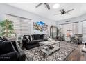 Bright living area with ceiling fans and a serene aesthetic at 1144 W Tremaine Ave, Gilbert, AZ 85233