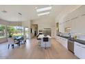 Spacious open concept kitchen with a large island, high-end appliances, and hardwood floors at 12225 E Cortez Dr, Scottsdale, AZ 85259