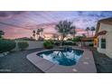 Beautiful backyard featuring a private pool, spa, mature trees, and a block fence for added privacy at 14248 N 56Th Pl, Scottsdale, AZ 85254