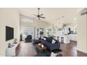 Open concept living area showcases a vaulted ceiling, fan, and seamless flow to the dining and kitchen spaces at 14248 N 56Th Pl, Scottsdale, AZ 85254