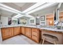 Spacious primary bathroom with dual sinks, granite countertops and vanity area at 17404 N 99Th Ave # 318, Sun City, AZ 85373