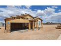 New home under construction, showcasing the framing and garage at 18232 W La Senda Dr, Surprise, AZ 85387