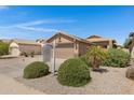 Single-story home featuring desert landscaping, a two-car garage, and a tile roof at 2318 W Kristina Ave, San Tan Valley, AZ 85144