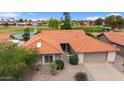 A beautiful aerial view of the home with a well-manicured front yard and terracotta roof at 2461 Leisure World --, Mesa, AZ 85206