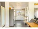 Bright kitchen features stainless steel appliances, white cabinets, gray countertops and subway tile backsplash at 2542 W Missouri Ave, Phoenix, AZ 85017
