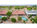 Aerial view of backyard with pool and patio with a red tiled roof at 6019 E Paradise Ln, Scottsdale, AZ 85254