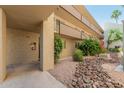 Exterior view of a condo building with well-maintained landscaping and walkways at 7625 E Camelback Rd # B124, Scottsdale, AZ 85251