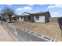Cozy single-level home with a minimal front yard requiring basic care at 7720 W Indianola Ave, Phoenix, AZ 85033