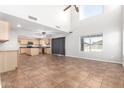Spacious living room with high ceilings and large windows offering plenty of natural light at 1210 W Agrarian Hills Dr, San Tan Valley, AZ 85143