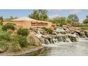 Water feature and monument sign reading San Tan Heights in a Primary-planned community at 3229 W Five Mile Peak Dr, San Tan Valley, AZ 85144