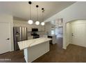 Open kitchen featuring white cabinets, quartz countertops, a center island, and stainless steel appliances at 3229 W Five Mile Peak Dr, San Tan Valley, AZ 85144
