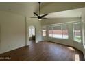 Bright main bedroom with wood-look flooring and a private bathroom at 3229 W Five Mile Peak Dr, San Tan Valley, AZ 85144