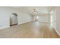 Bright living room with vaulted ceilings, vinyl flooring, and an open layout at 3774 W Wood Dr, Phoenix, AZ 85029