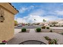 View of a suburban neighborhood street with well-maintained lawns and residential homes at 4106 E Lavender Ln, Phoenix, AZ 85044