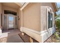 A close up of the front entry, showing decorative glass sidelights and door at 6003 N 132Nd Dr, Litchfield Park, AZ 85340