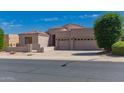 Attractive single-story home with a well-maintained front yard and three car garage, offering curb appeal and convenience at 6043 W Robin Ln, Glendale, AZ 85310