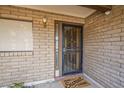 Close-up of the front door with a security screen and a welcoming doormat at 14221 N 45Th St, Phoenix, AZ 85032