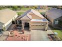 Aerial view of the home showcasing its desert landscaping, front yard, and proximity to the golf course at 1437 E Glenhaven Dr, Phoenix, AZ 85048