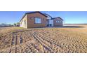 Modern-design home featuring sleek lines, expansive grounds and minimalist landscaping at 3033 N 367Th Ave, Tonopah, AZ 85354
