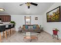 Bright and airy living room with modern furnishings, including sofa seating, bar, and chic accents at 625 W Mckellips Rd # 80, Mesa, AZ 85201