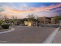 Wide view of the community entrance highlighting the signage and desert landscaping at sunset at 13450 E Via Linda -- # 2041, Scottsdale, AZ 85259