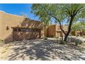 Exterior showcasing the attached garages, desert landscaping, and classic architecture at 13450 E Via Linda -- # 2041, Scottsdale, AZ 85259