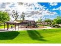 Community park featuring a playground, gazebo, green grass and shady trees at 16333 N 181St Ave, Surprise, AZ 85388