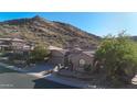 Beautiful exterior view of home and desert mountain, showcasing the home's setting and neighborhood at 28770 N 69Th Ln, Peoria, AZ 85383