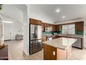 Modern kitchen with stainless steel appliances, granite countertops, and an island at 1033 E Mountain Vista Dr, Phoenix, AZ 85048