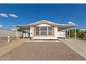 Charming home featuring a covered carport and low-maintenance front yard at 1053 S 96Th St, Mesa, AZ 85208