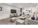 Bright and airy living room featuring modern decor, plush seating, and a stylish accent rug at 10986 W Polk St, Avondale, AZ 85323