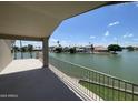 Balcony view overlooking the lake, surrounded by residential neighborhood at 1414 N Palmsprings Dr, Gilbert, AZ 85234