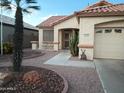 Inviting single-story home showcasing desert landscaping with a decorative walkway at 17640 W Babbitt Dr, Surprise, AZ 85374