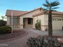 Inviting single-story home showcasing desert landscaping with a decorative walkway at 17640 W Babbitt Dr, Surprise, AZ 85374