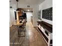 Stylish kitchen with granite countertops, a breakfast bar, and stainless steel appliances at 200 E Southern Ave # 133, Tempe, AZ 85282
