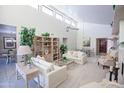 Spacious living room with vaulted ceilings, fireplace, and comfortable seating arrangement at 2635 N 62Nd St, Mesa, AZ 85215