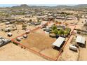 Expansive aerial view of horse property with large lot, arena, barn and mature trees at 28061 N Holly Rd, San Tan Valley, AZ 85143