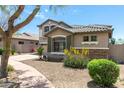 Home with a well-maintained lawn and desert landscaping at 3025 W Sentinel Rock Rd, Phoenix, AZ 85086