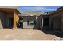 Exterior view of home under construction, showing large windows and modern architectural style at 3374 E Aquarius Ct, Chandler, AZ 85249