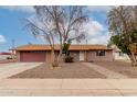 Welcoming home with a neatly landscaped front yard and a two-car garage at 3916 W Northview Ave, Phoenix, AZ 85051