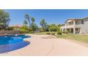 Lush backyard features a sparkling swimming pool and a spacious deck, creating an inviting outdoor oasis at 4490 S Rio Dr, Chandler, AZ 85249