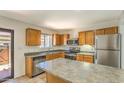 Functional kitchen with stainless steel appliances, island, and ample counter space, ready for culinary adventures at 6262 E Brown Rd # 65, Mesa, AZ 85205